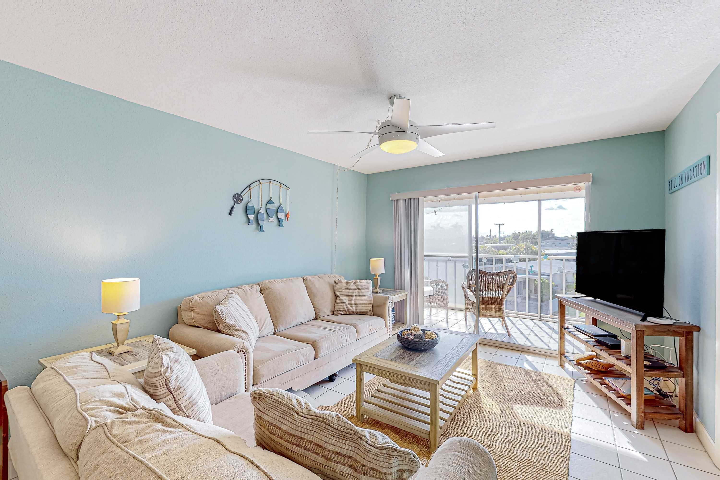 Living area with sectional and beach light