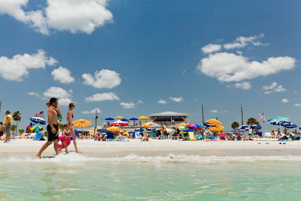 Treasure Island beach with palms and umbrellas